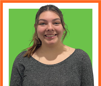 Rileigh Roberts, SERVPRO employee against a green background