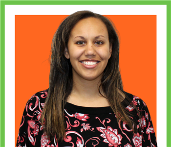 Kaileigh Plant Under The SERVPRO Sign For Her Employee Photo