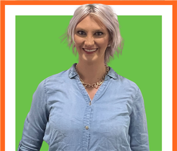 Kacie, woman, SERVPRO employee against a green background